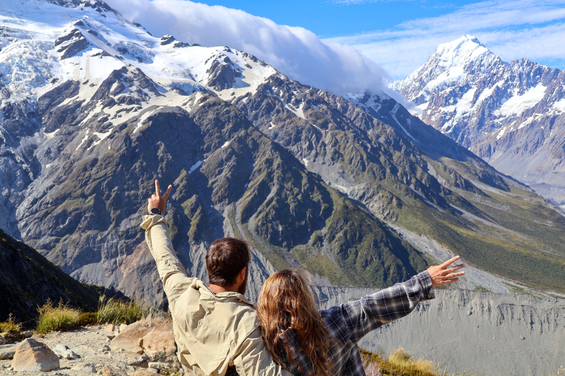 Couple embracing the view of New Zealand mountains