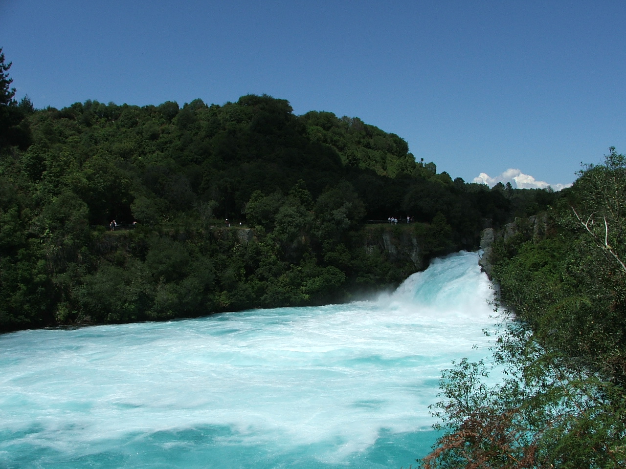 Huka Falls turquoise water rushing through a narrow gorge near Taupo, New Zealand