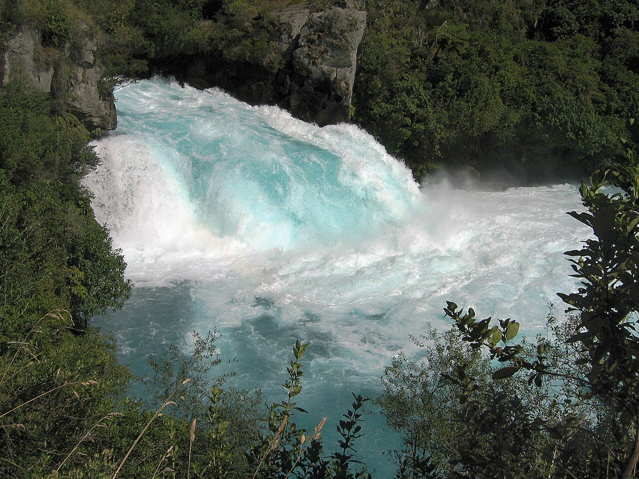 Huka Falls turquoise water rushing through a narrow gorge near Taupo, New Zealand
